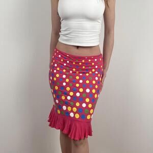 Pink polka dot midi skirt with ruffle hem.